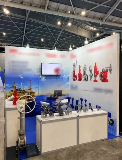 Industrial models arranged on display counters in a trade show booth